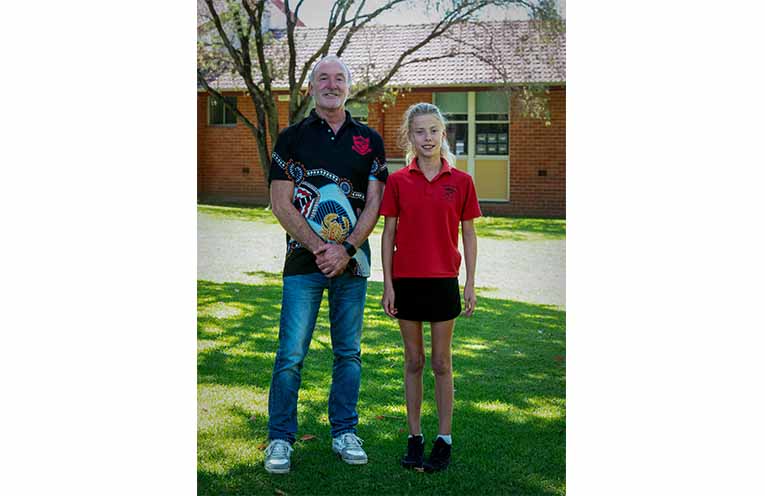Scarlet with Laurieton Public School principal Grant Timmins. Photo Kim Ambrose/SaltyFoxFotography.