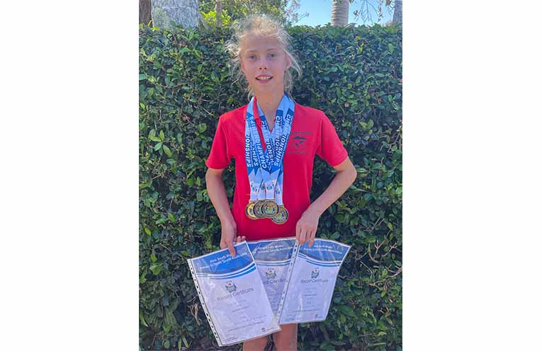 Scarlet with her haul of medals from the State PSSA championships. Photo: supplied.