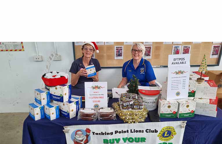 Lions Club members Dee Watkinson and Karen Carrick selling Lions’ Christmas cakes at Bunnings. Photo: supplied.