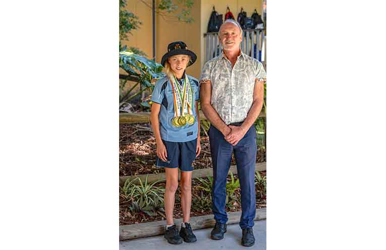 Scarlet Monk with Laurieton Public School Principal Mr Grant Timmins. Photo: Kim Ambrose/SaltyFoxFotography.