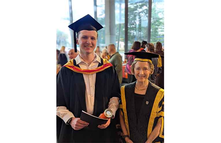 Paramedicine graduate Ryan Ostermann with Vice Chancellor Renée Leon.