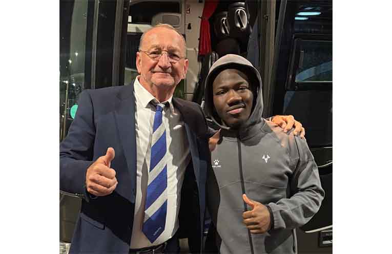 Mark Trenter poses with Socceroos star Nestory Irankunda. Photo: supplied.
