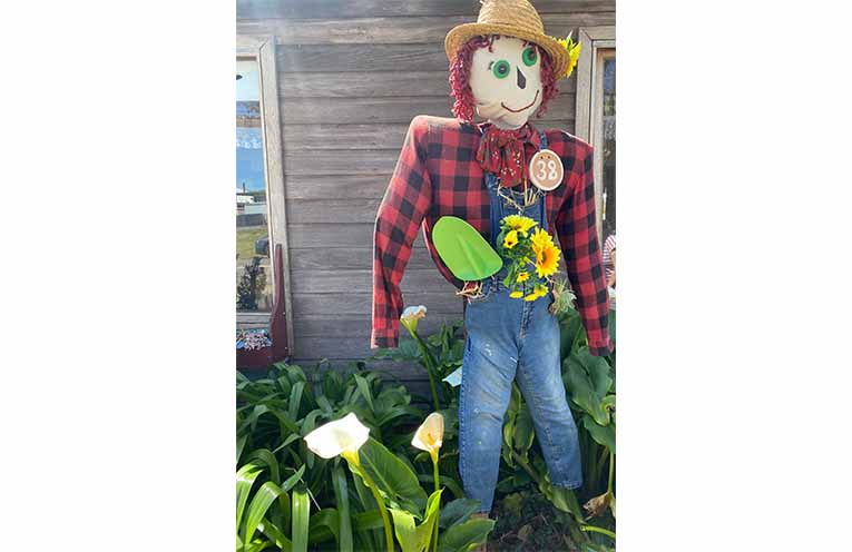 Scarecrow outside of Udder Cow Cafe.