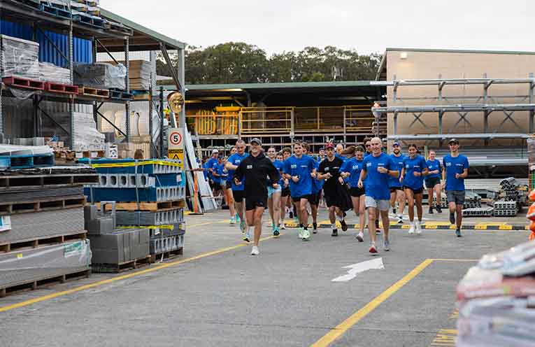 Members of the Port Macquarie tradie community gathered at Mitre 10 for an early-morning run followed by breakfast and conversation about looking after themselves and their mates. Photos: Supplied.