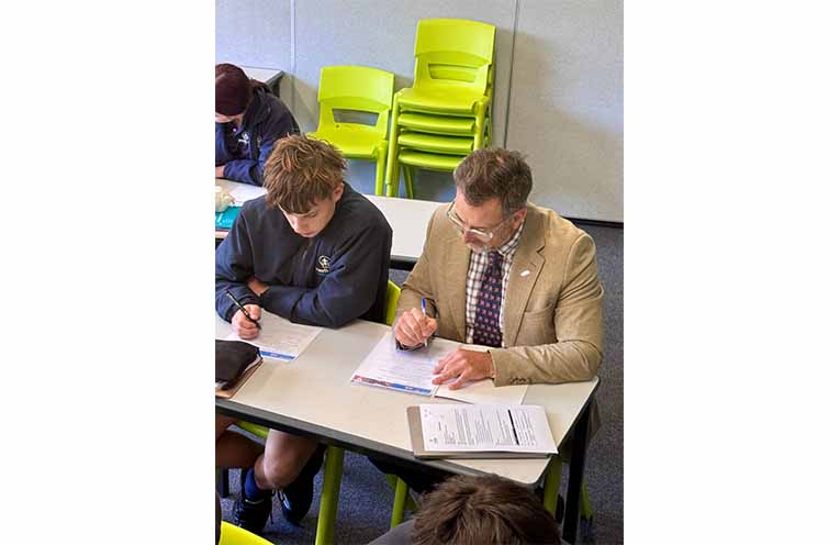 Principal-turned-student and his classmate at work in the classroom. Photo: Heritage Christian School.